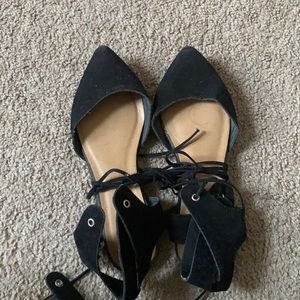 Black gladiator style, pointed toe flats.